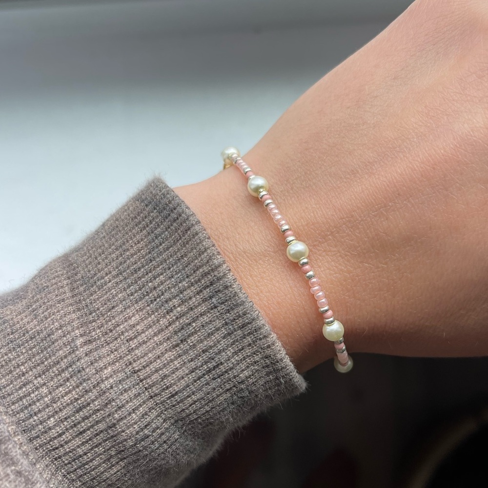 Homemade pink, gold, and pearl bracelet